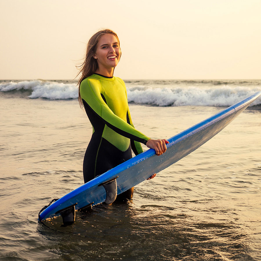 active-women-with-surf-board-enjoy-watersport-at-v-HG56E4G-1.jpg